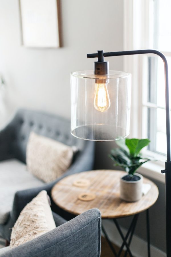 clear glass lamp on table